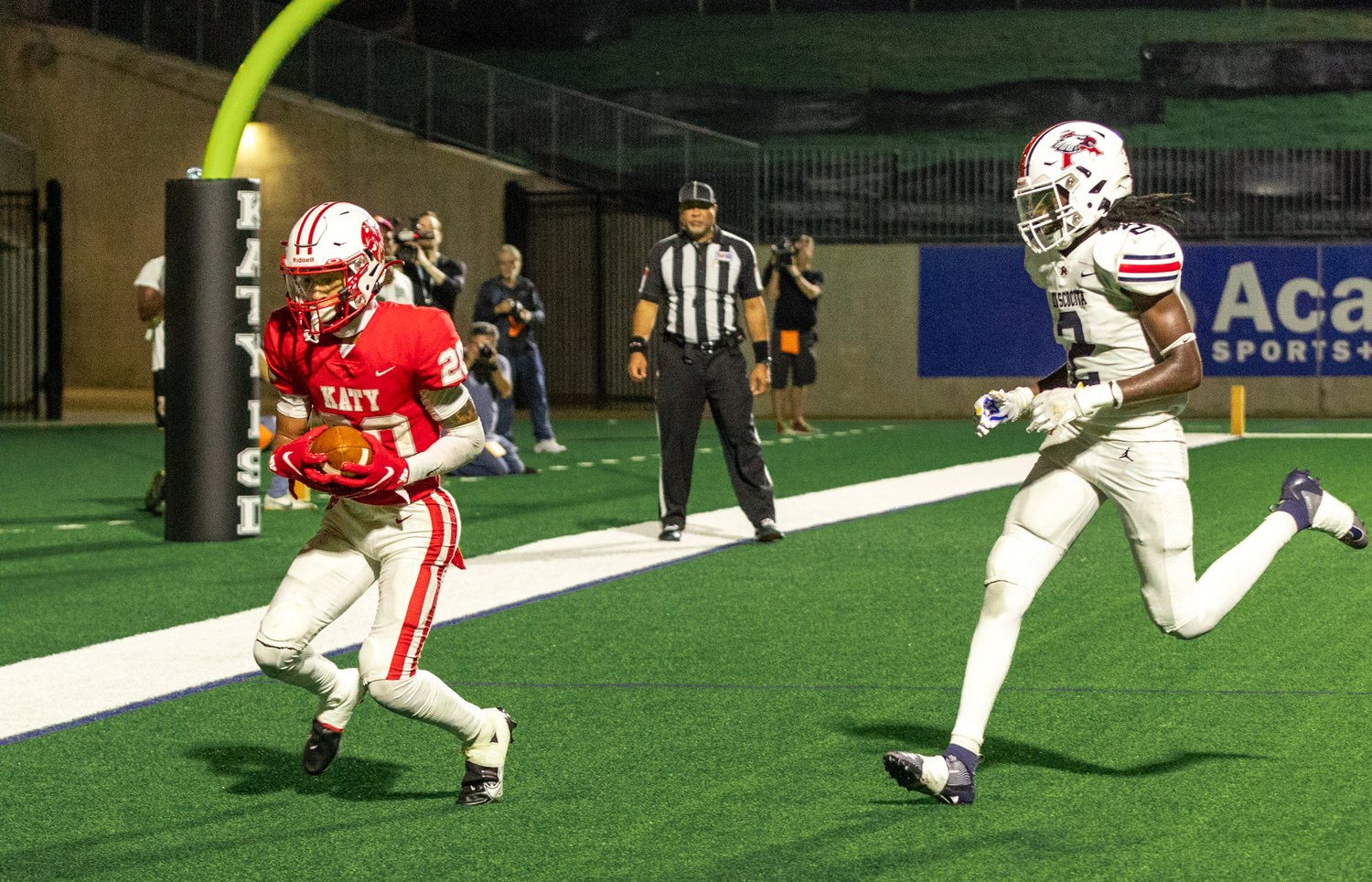 Katy’s Micah Koenig catches a touchdown pass during a game between Katy and Atascocita at Legacy Stadium.